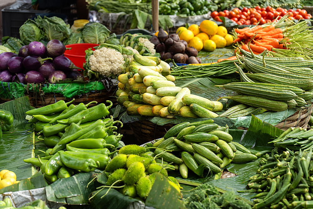 Vendor displays different vegetables at a stall to sell