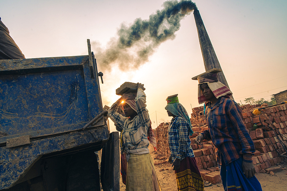 Women labourers working in a brick factory in Assam, India