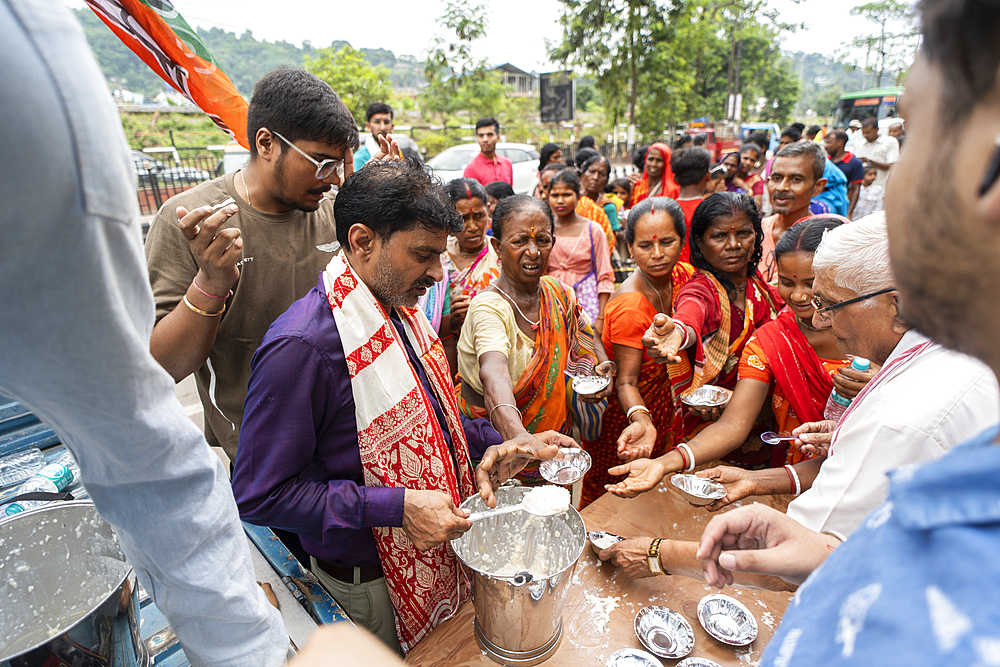 Devotees throng to have food as they arrives to visit Kamakhya Temple during Ambubachi Mela, in Guwahati, India on June 22, 2025.