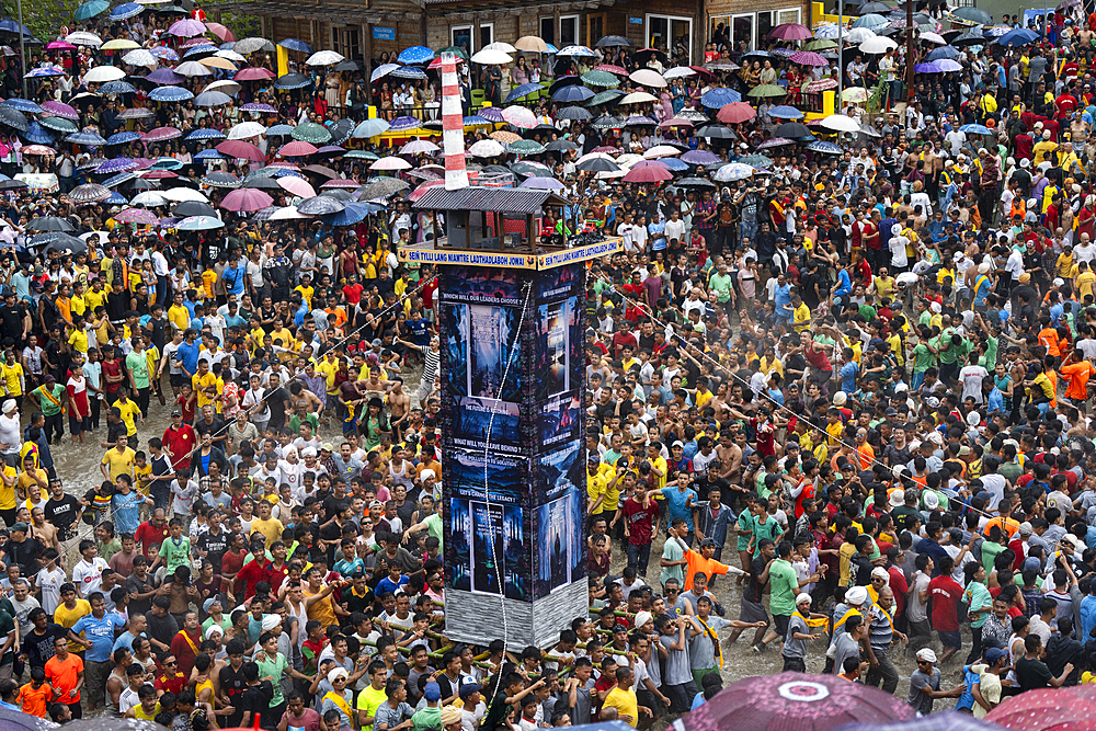 People from the Pnar community march in a circle around a Rot as they celebrate an event organised to mark the Behdienkhlam festival in Jowai, India, on July 14, 2025.