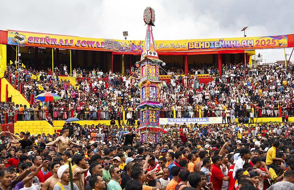 People from the Pnar community march in a circle around a Rot as they celebrate an event organised to mark the Behdienkhlam festival in Jowai, India, on July 14, 2025.