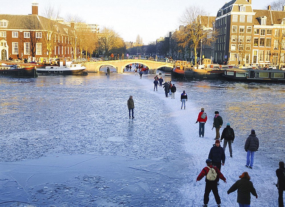 Skaters and walkers on frozen Amstel River,Amsterdam, Netherlands