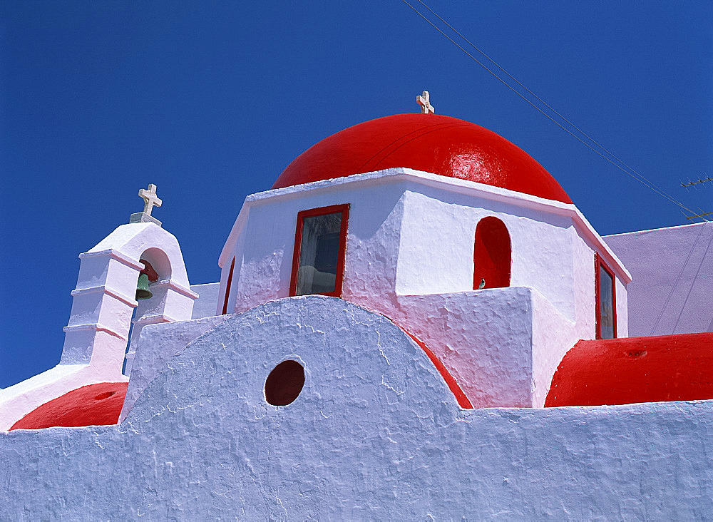 Close-up of white walls and red roof and dome of a church on Mykonos, Cyclades, Greek Islands, Greece,Europe