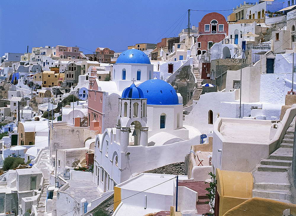 View over the blue domes and white houses of the village of Oia, Santorini (Thira), Cyclades, Greek Islands, Greece, Europe