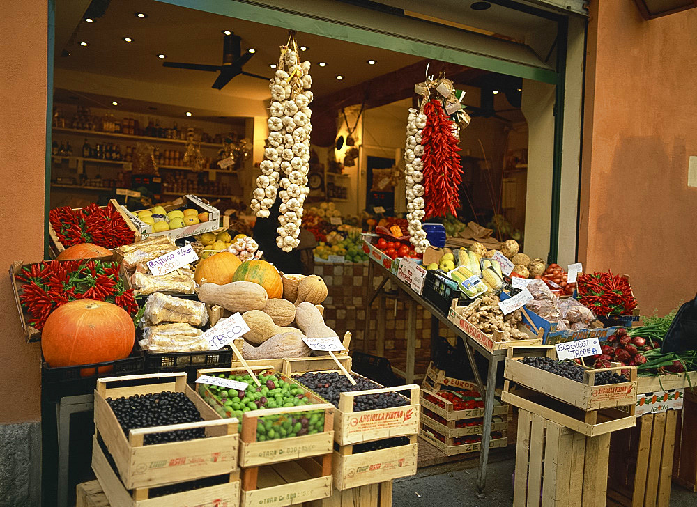 Vegetable shop selling garlic, olives and squash, in the market in Bologna, Emilia Romagna, Italy, Europe