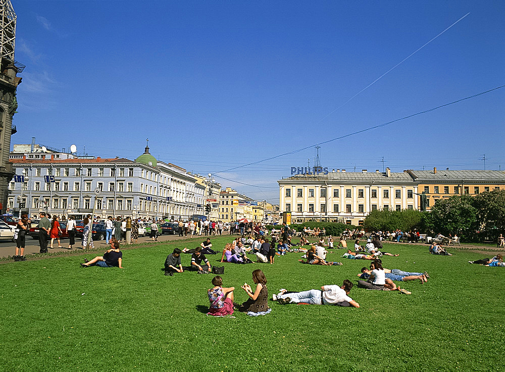 People relaxing on the grass in summer in Nevsky Prospect, in the city of St. Petersburg, Russia, Europe