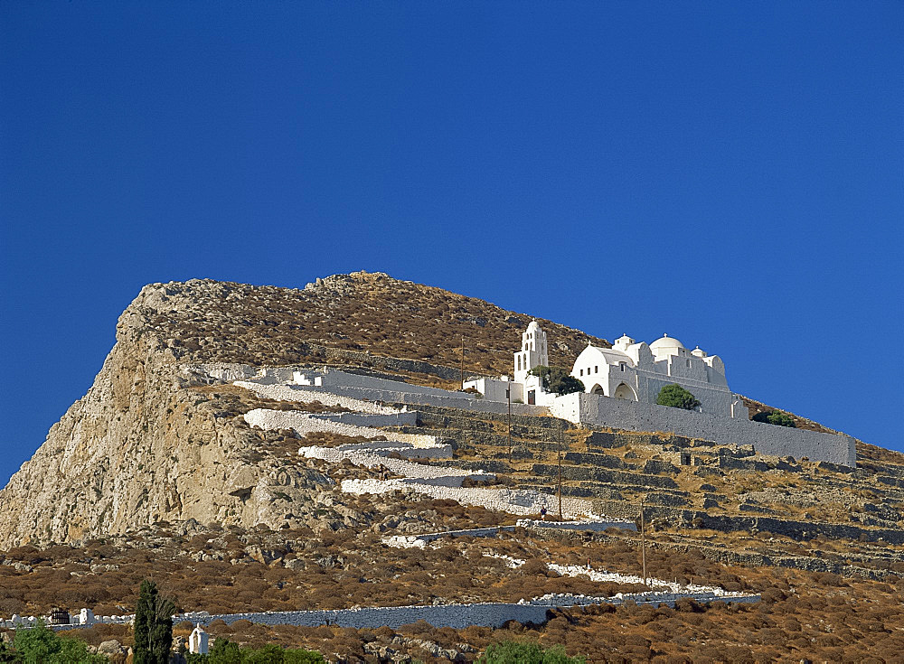 White walls line zigzag path up to Church of the Assumption of the Virgin Mary, above terraces on Folegandros, Cyclades, Greek Islands, Greece, Europe