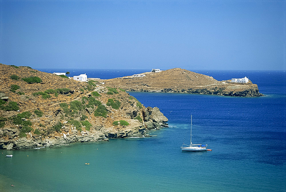 Boat and coastline of the Bay of Apokofto on Sifnos, Cyclades Islands, Greek Islands, Greece, Europe