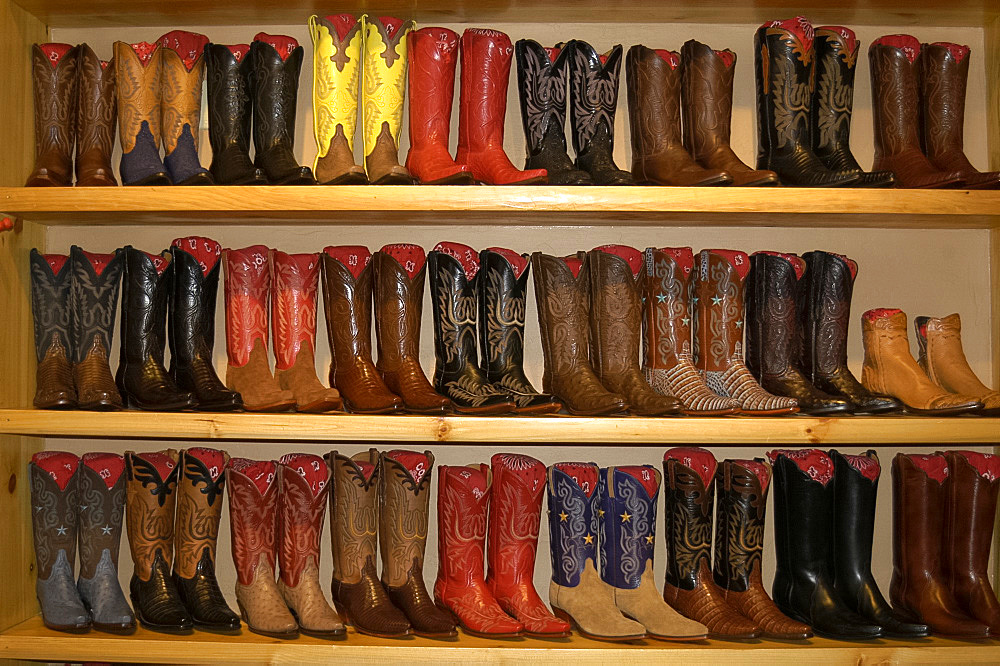 Display of ornate cowboy boots in a shop in Aspen, Colorado, USA, North America