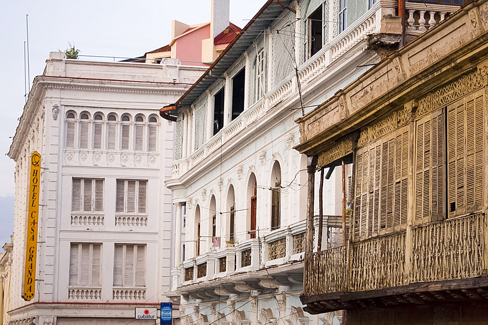 A collection of old buildings including the Casa Granda Hotel in central Santiago de Cuba, Cuba, West Indies, Central America