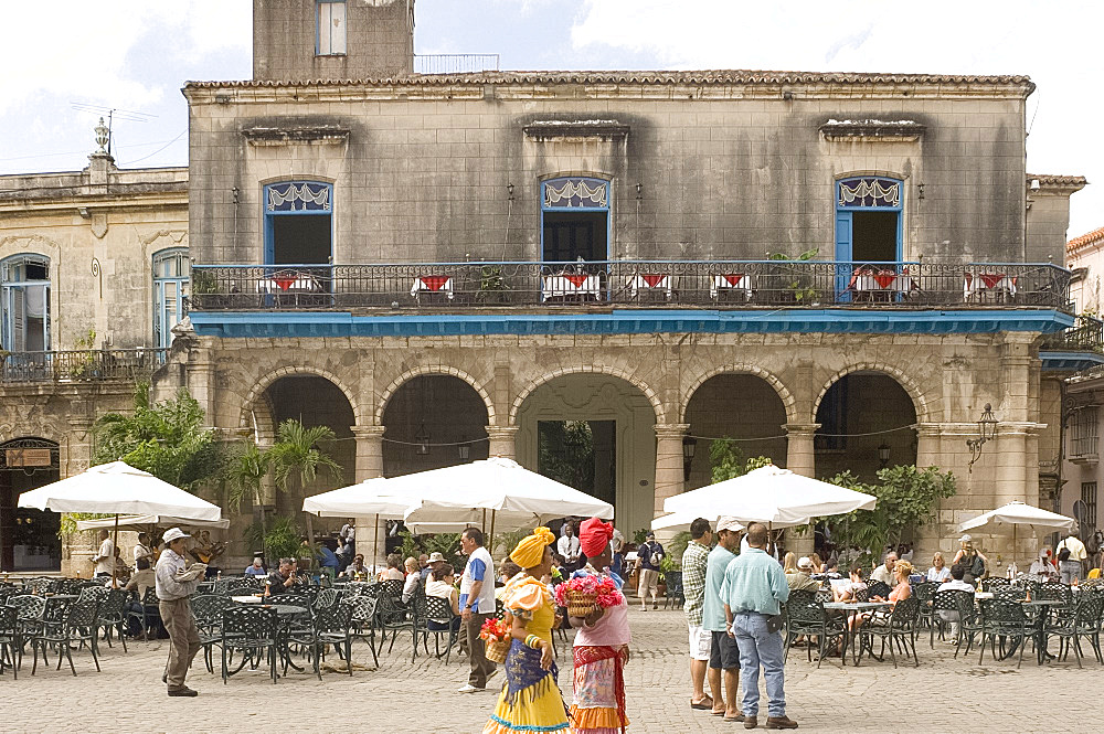 Flower ladies looking for tourists to be photographed with them, Plaza de la Catedral, Habana Vieja (old town), Havana, Cuba, West Indies, Central America