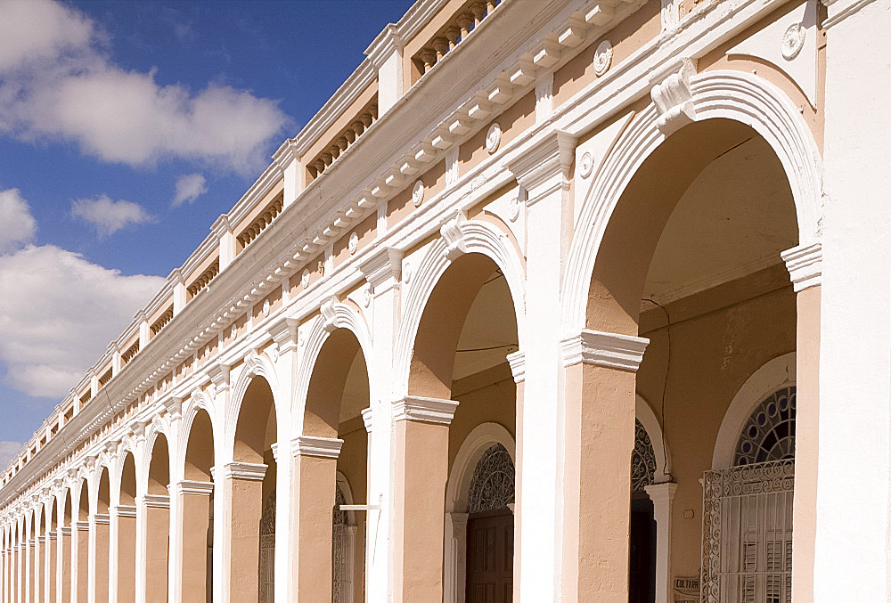 An arcade on a building near Parque Marti in Cienfuegos, Central Cuba, Cuba, West Indies, Central America