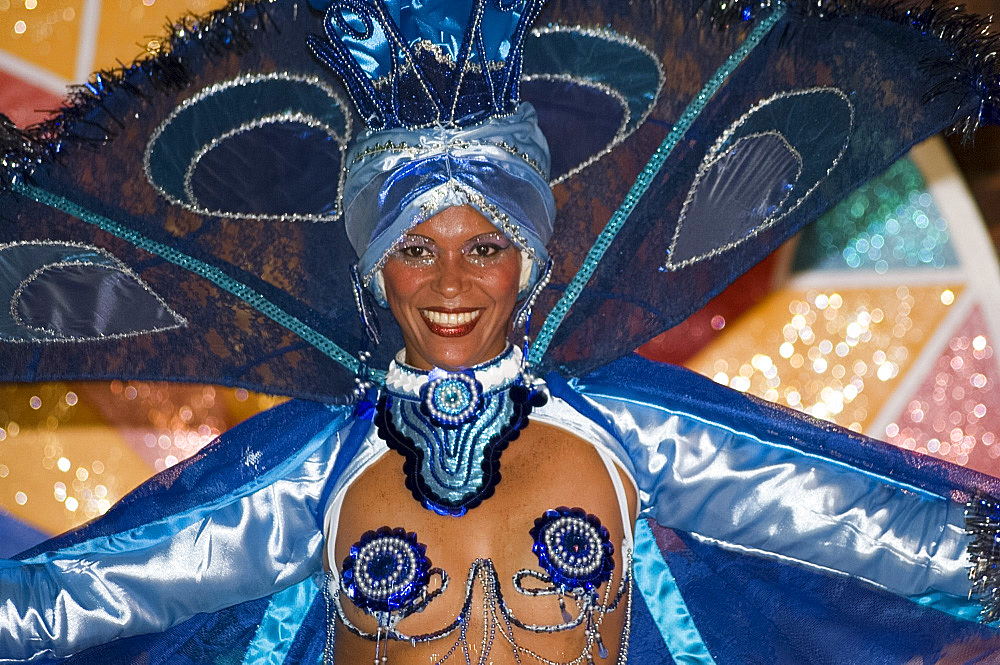 A dancer in an elaborate sequined costume performing at the Brisas Trinidad del Mar Hotel near Trinidad, Cuba, West Indies, Central America