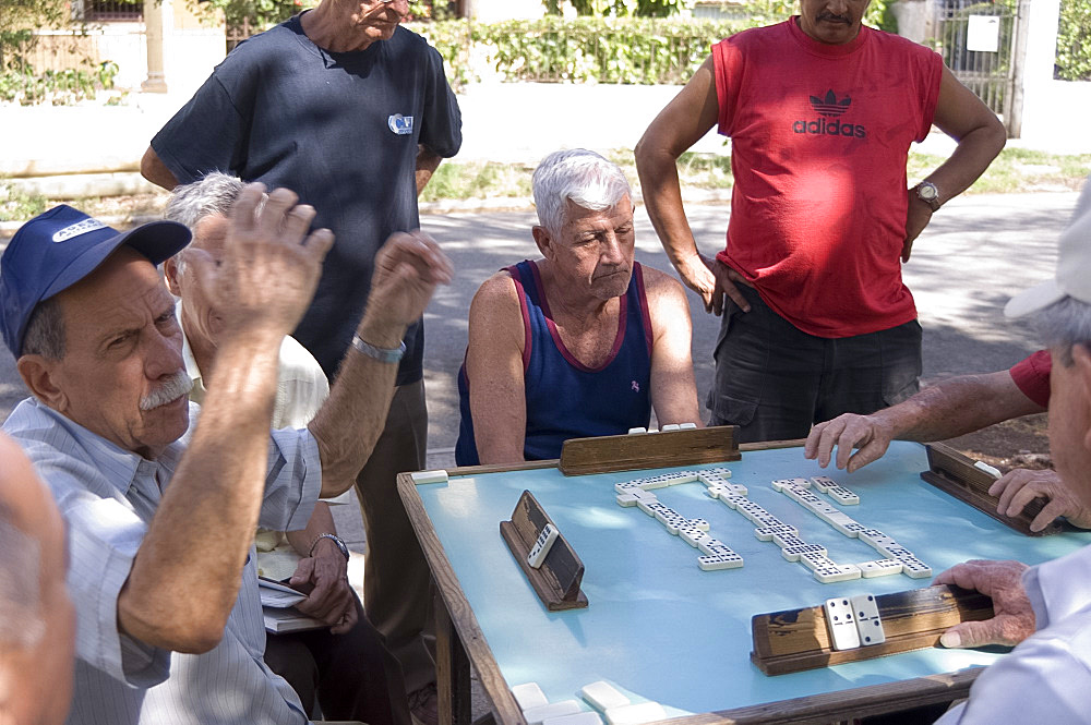 Men playing dominoes in the Vedado district, Havana, Cuba, West Indies, Central America