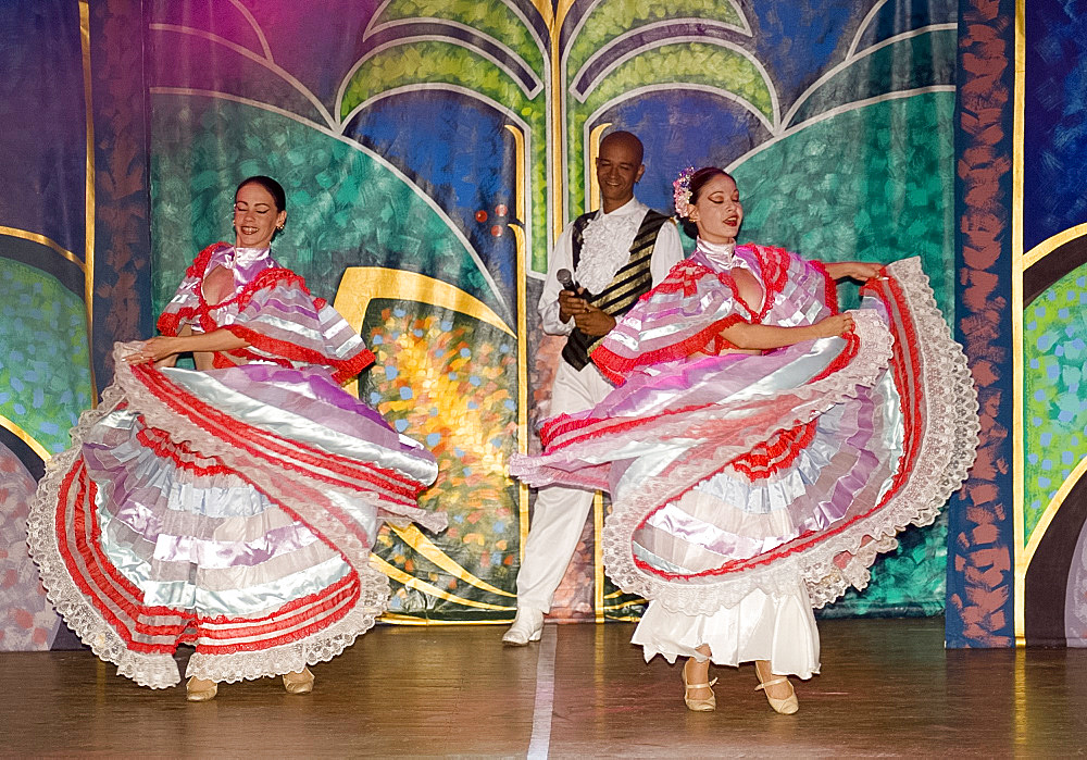 Flamenco dancers in colourful costume performing at the Melia Rio de Oro Hotel, Playa Esmeralda, Guardalavaca, Cuba, West Indies, Central America