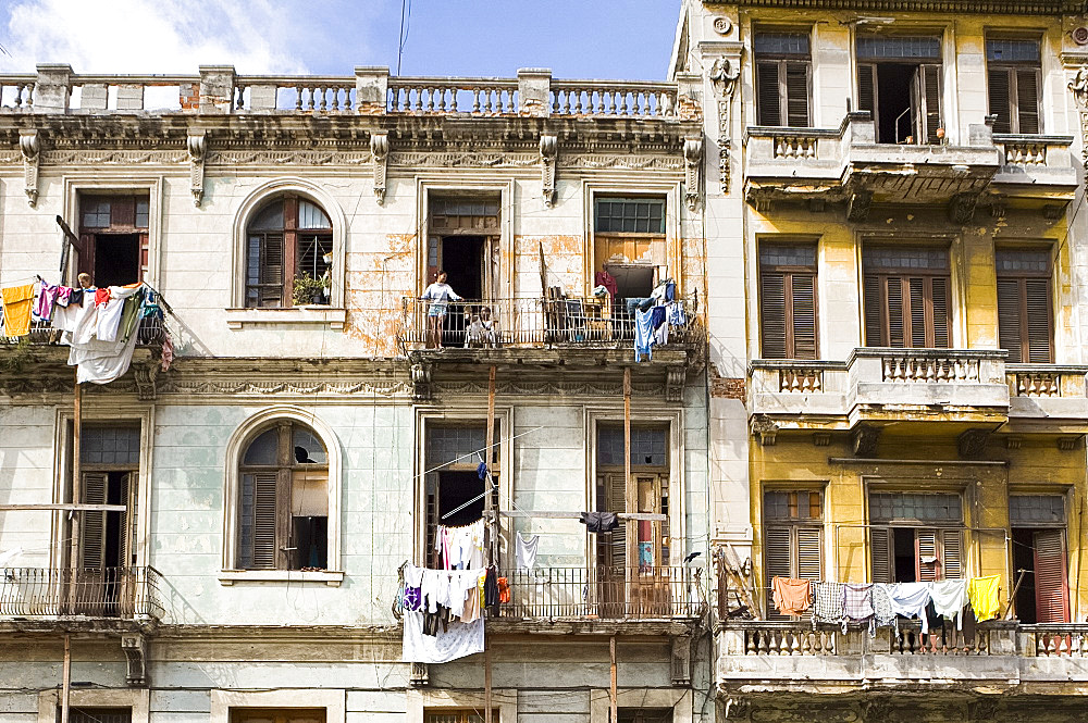 Laundry hanging from the balcony of buildings central Havana, Cuba, West Indies, Central America