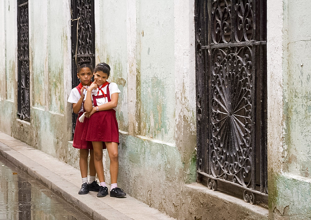 Two schoolgirls on a street in Habana Vieja, Havana, Cuba, West Indies, Central America