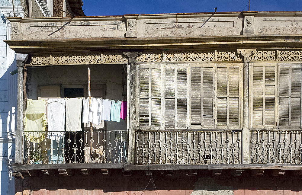 Laundry and wooden shutters on a balcony, Santiago de Cuba, Cuba, West Indies, Central America