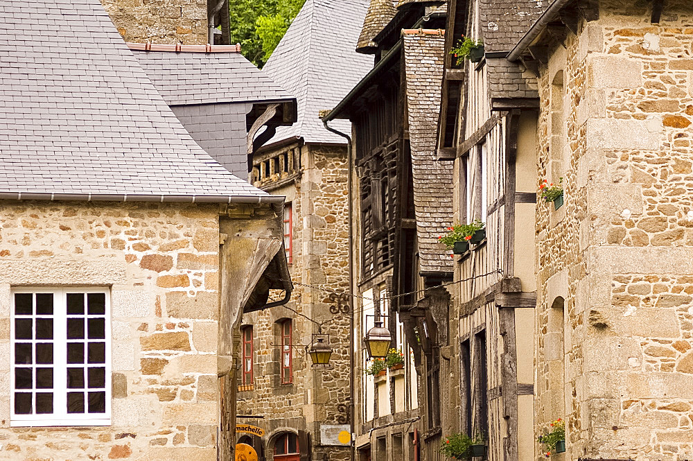 Old half timbered and stone buildings in the picturesque village of Dinan, Brittany, France, Europe