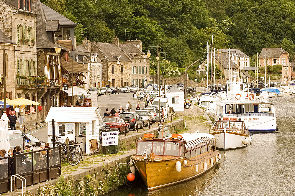 Boats on the River Rance and waterfront cafes in Port du Dinan, Brittany, France, Europe