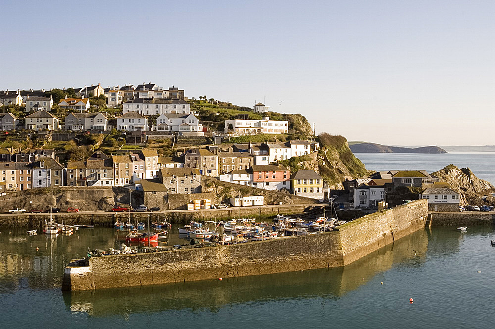 Houses on headland surrounding the old fishing port, Mevagissey, Cornwall, England, United Kingdom, Europe