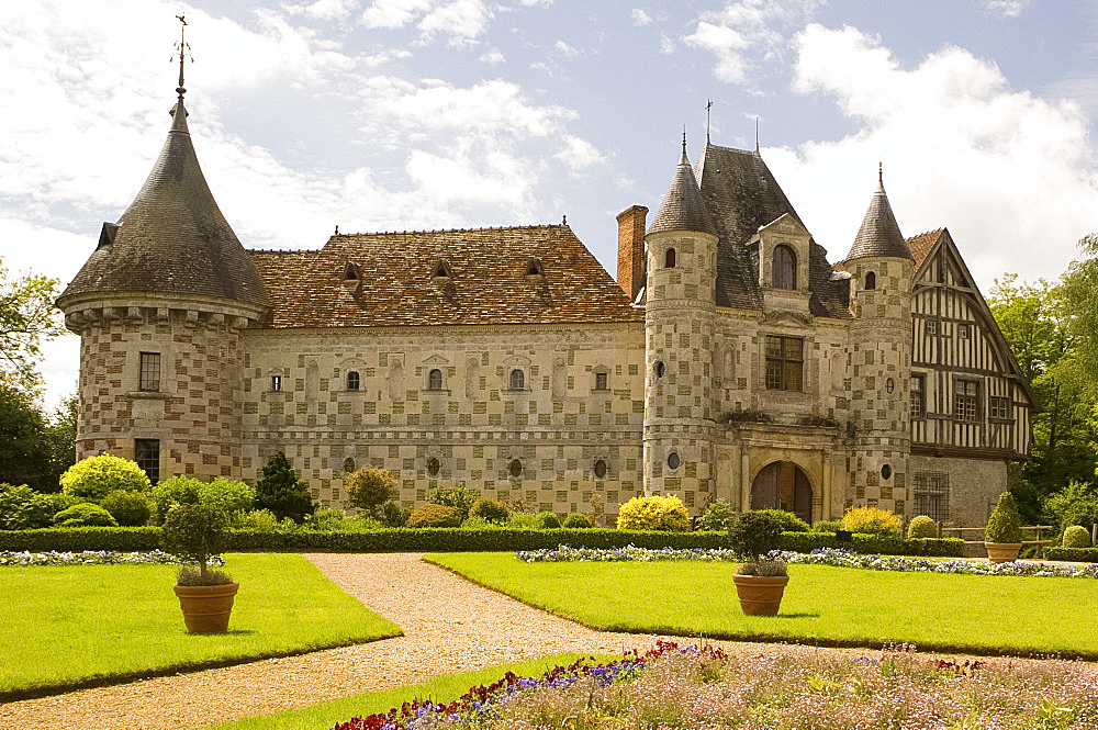 The chateau of St.-Germanine-de-Livet with a colourful checked facade and gardens, Normandy, France, Europe