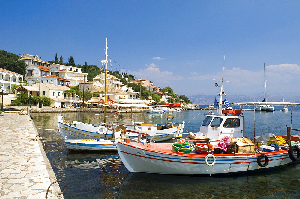 Fishing boats in the harbour in Kassiopi on the northeast coast of Corfu, Ionian Islands, Greek Islands, Greece, Europe