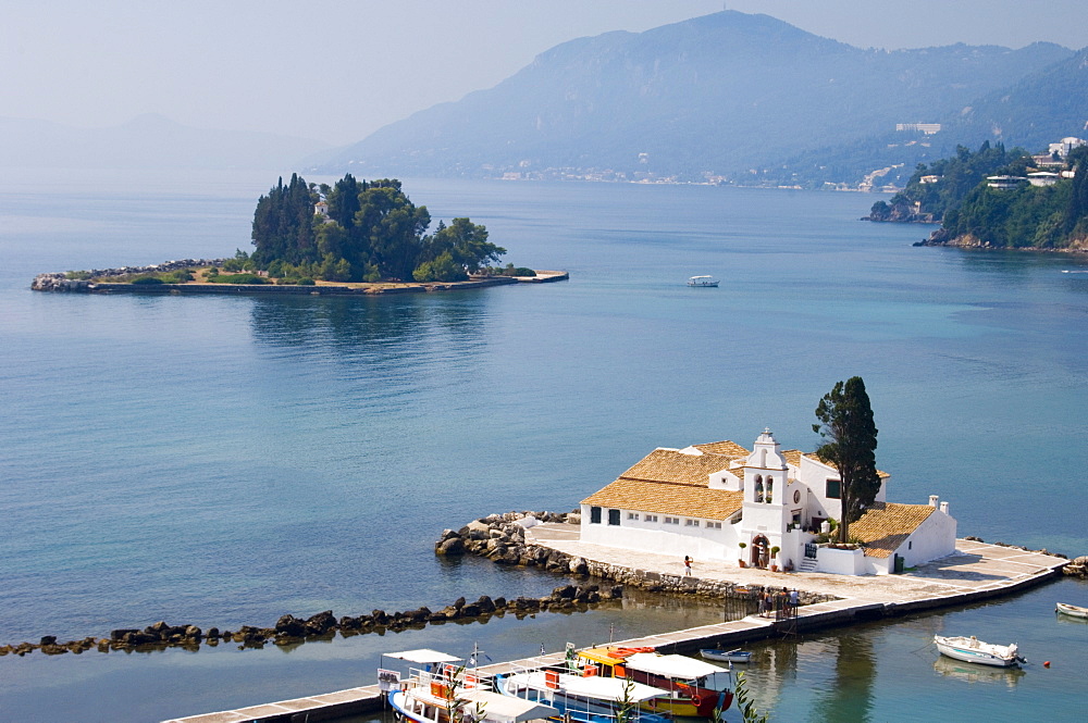 An aerial view of Vlacherna Monastery and Pontikonissi Island in the distance, Corfu, Ionian Islands, Greek Islands, Greece,Europe