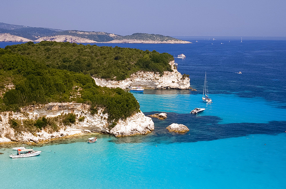 A view of the northeast coast of Anti-Paxos from a taverna above Voutoumi Beach, Anti-Paxos, Ionian Islands, Greek Islands, Greece, Europe