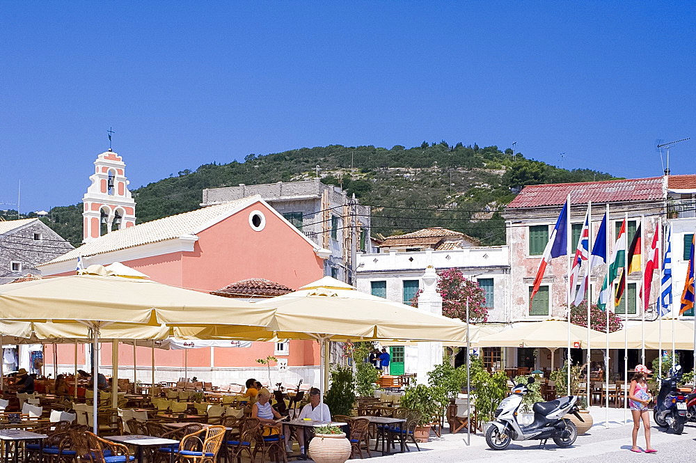 The main square with a church and tavernas in Gaios, Paxos, Ionian Islands, Greek Islands, Greece, Europe