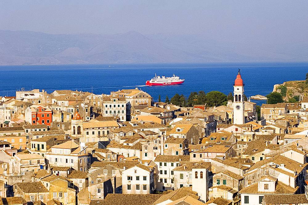 Aerial view of Corfu Old Town and St. Spyridonas belltower from the New Fort, with ferry in the Ionian Sea, Corfu, Ionian Islands, Greek Islands, Greece, Europe