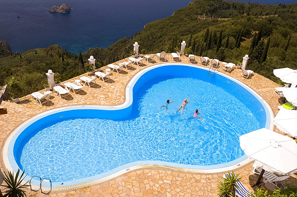 An overhead view of a swimming pool on a clifftop at Paleokastritsa, west coast, Corfu, Ionian Islands, Greek Islands, Greece, Europe