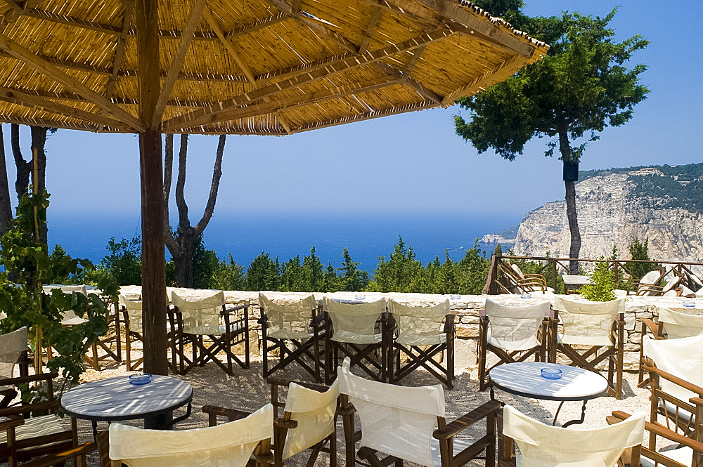 The Sunset Bar on the west coast of Paxos overlooking the dramatic Ermitis Cliffs, Paxos, Ionian Islands, Greek Islands, Greece, Europe