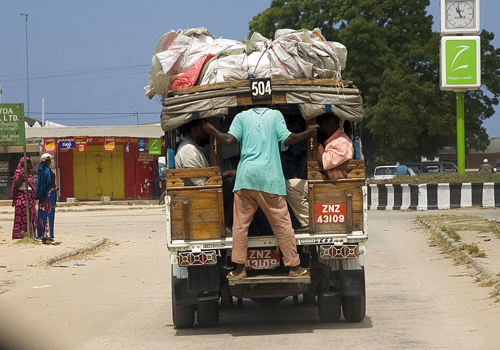 People packing into a dale dale, the local form of transport, Zanzibar, Tanzania, East Africa, Africa