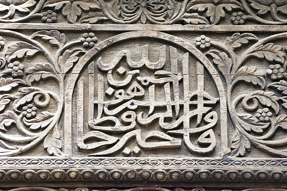 Intricate wood carving around the main door to the Dhow Palace Hotel in Stone Town, Zanzibar, Tanzania, East Africa, Africa