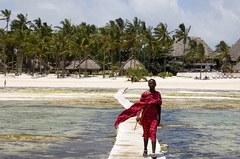 A Maasai tribesman on the sea walkway near the Karafuu Hotel, Pingwe, Zanzibar, Tanzania, East Africa, Africa