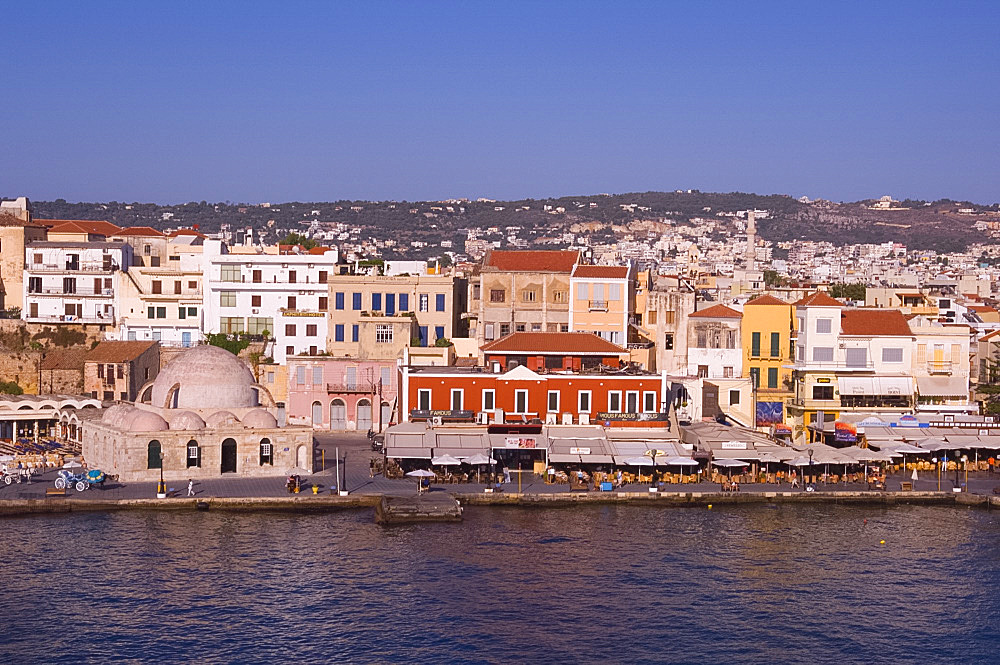 A view of tavernas around the harbour and the Kutchuk Hasan Mosque in the old town section of Hania, Crete, Greek Islands, Greece, Europe