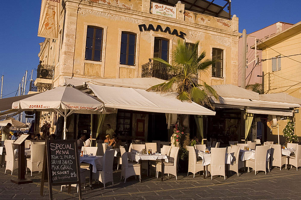 A taverna on the harbour in the old section of Hania, Crete, Greek Islands, Greece, Europe