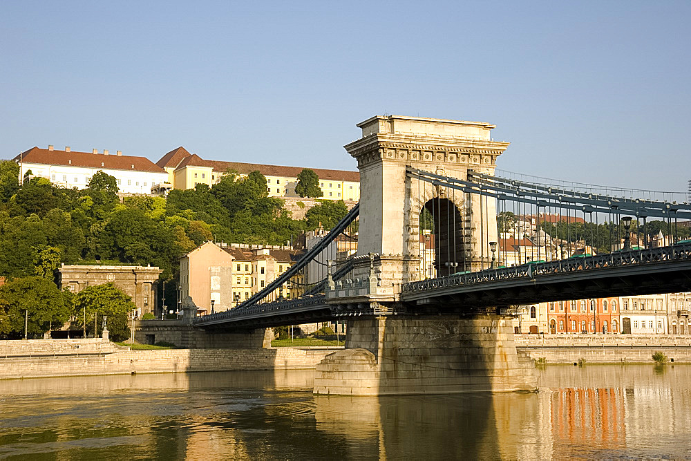 Early morning sailing under the Chain Bridge over the Danube River, Budapest, Hungary, Europe