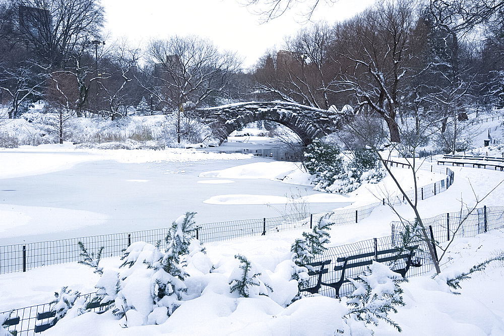 An early morning view of the Gapstow Bridge after a snowfall in Central Park, Manhattan, New York City, New York State, USA