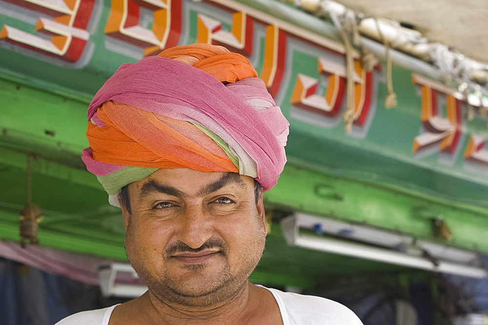 The owner of a turban shop outside his store in Jodhpur, Rajasthan, India, Asia