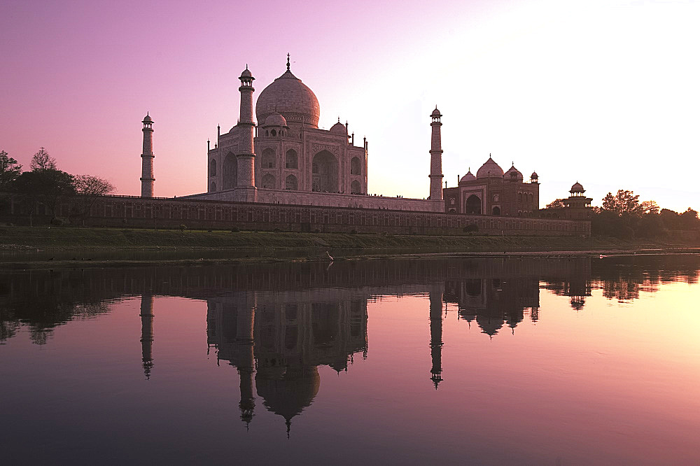 The Taj Mahal, UNESCO World Heritage Site, at sunset reflected in the Yamuna River, Agra, Uttar Pradesh, India, Asia