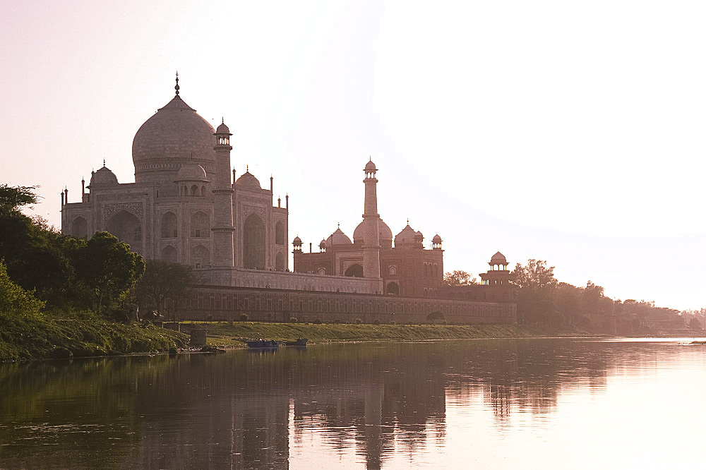 The Taj Mahal, UNESCO World Heritage Site, at sunset reflected in the Yamuna River, Agra, Uttar Pradesh, India, Asia