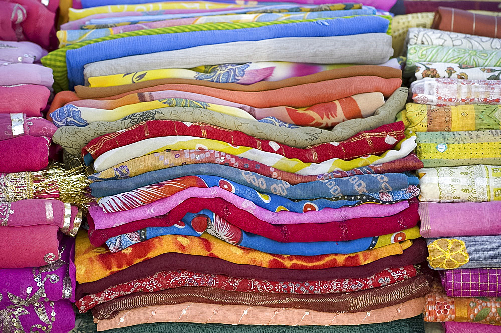 Piles of colourful scarves for sale in the Sardar Market in Jodhpur, Rajasthan, India, Asia