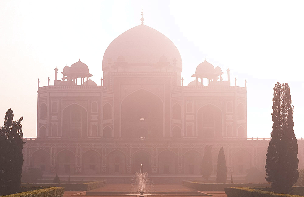 Humayun's Tomb, UNESCO World Heritage Site, the first great example of a Mughal garden tomb, in mist at sunrise Delhi, India, Asia