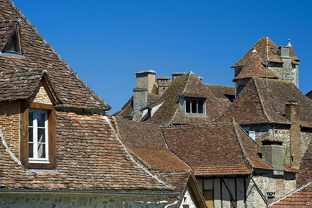 Rooftops in the picturesque village of Carennac and its typical Quercy architecture situated on the banks of the Dordogne River, Dordogne, France, Europe