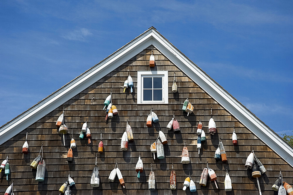 Painted wooden buoys on a shingled building in Sag Harbor, Long Island, New York State, United States of America, North America