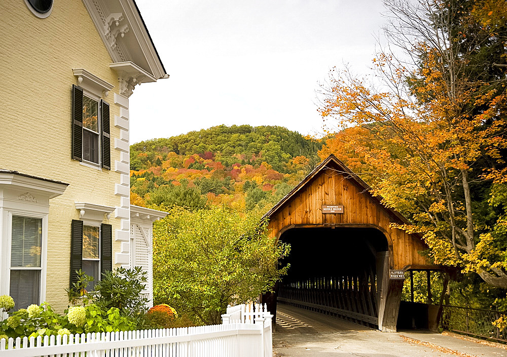 Middle Bridge, a covered wooden bridge surrounded by autumn foliage in the scenic town of Woodstock, Vermont, New England, United States of America, North America