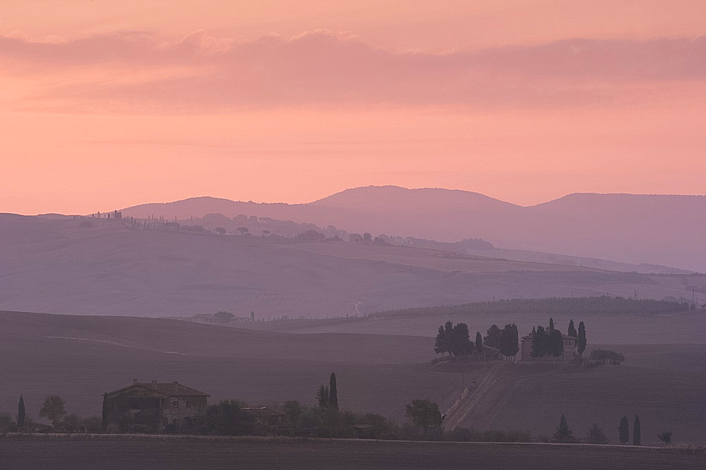 A view at dawn toward Pennella a stone farmhouse in the Val d'Orcia, UNESCO World Heritage Site, Tuscany, Italy, Europe