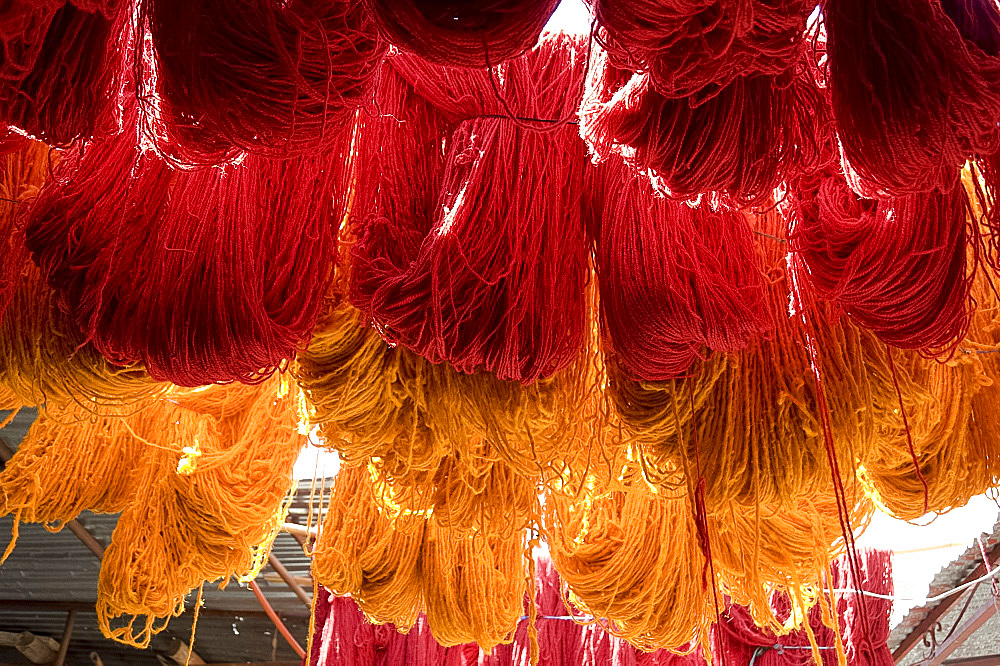 Brightly coloured wool hanging to dry in the dyers souk, Marrakech, Morocco, North Africa, Africa